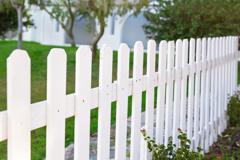 plant fence wood picket fence tree land lot rectangle grass home fencing shrub